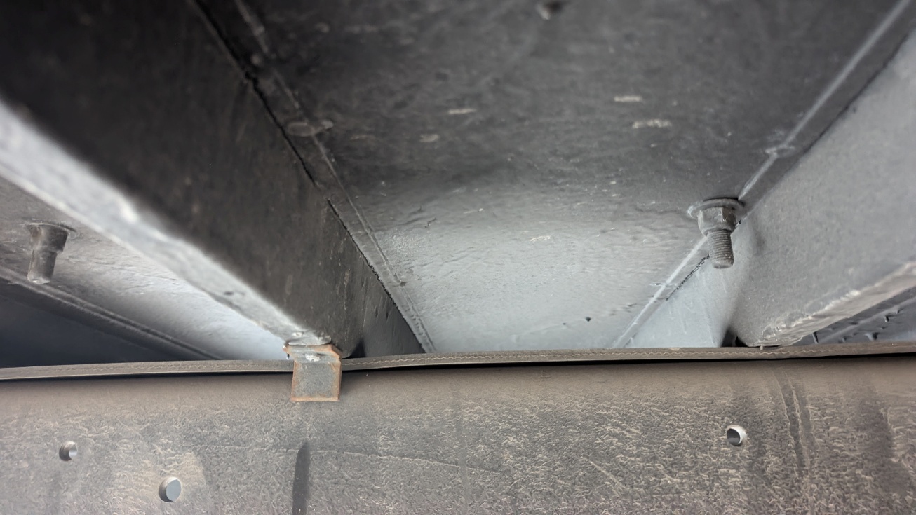 Figure 6 – Frame rail rubber strip and L-bracket.